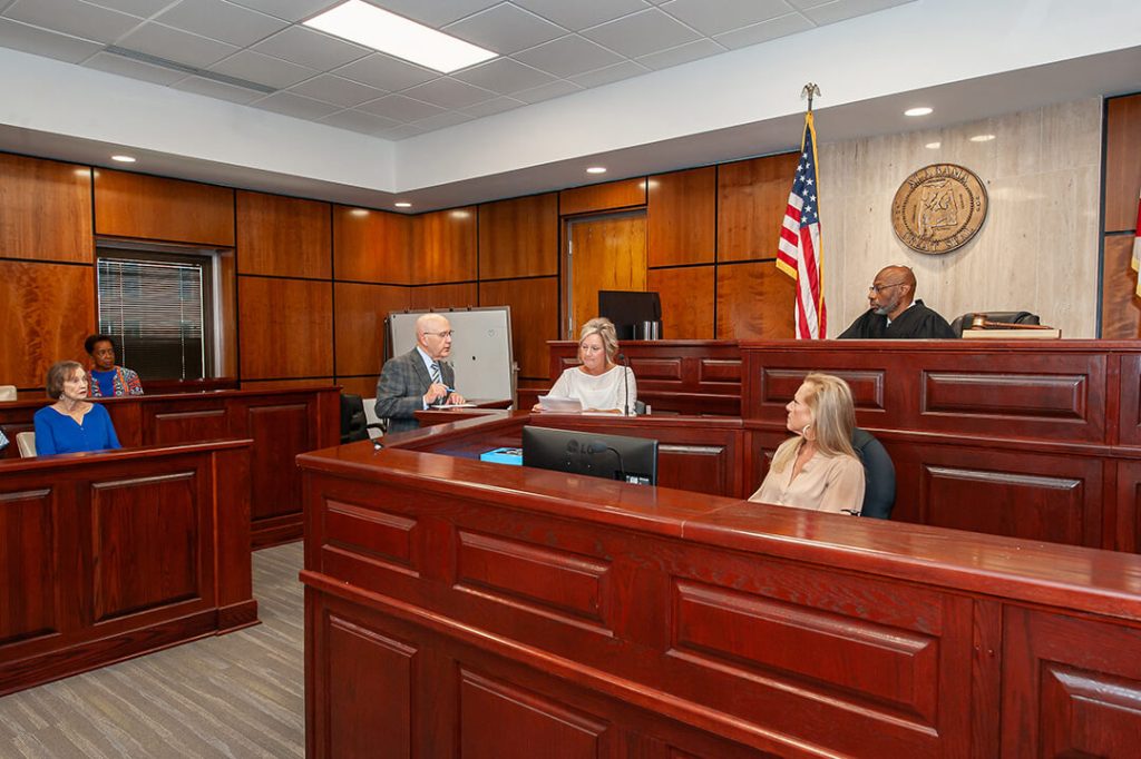 Judge Steverson presiding over courtroom with attorneys and jury
